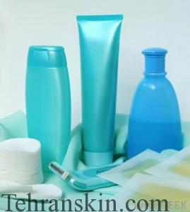 three-bottles-of-lotion-on-towel