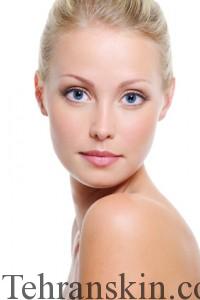 Close-up face of beautiful caucasian blonde woman with blue eyes over white